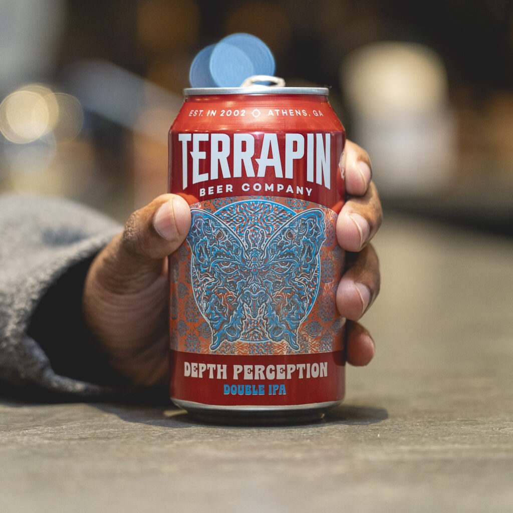Hand holding a can of Terrapin Depth Perception